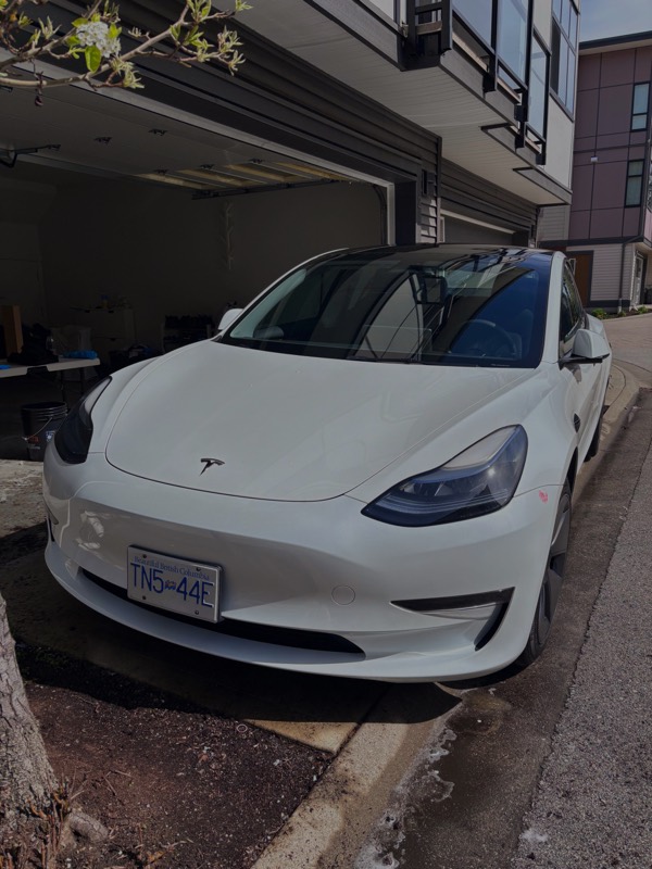 White Tesla Model 3 after a full interior and exterior detail